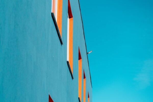 Blue building with orange window frames.